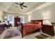 Spacious main bedroom with ceiling fan, sitting area, and windows allowing natural light at 283 Heron Lake Ct, Lawrenceville, GA 30043