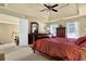 Cozy main bedroom features ceiling fan and windows for natural light at 283 Heron Lake Ct, Lawrenceville, GA 30043