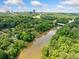 Beautiful aerial view showcasing the river and surrounding green space with city skyline in the distance at 4411 Paces Battle Nw, Atlanta, GA 30327