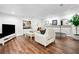 Spacious basement featuring a cozy seating area, mounted TV, and hardwood floors for entertainment and relaxation at 4411 Paces Battle Nw, Atlanta, GA 30327
