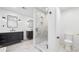 Bright bathroom features a glass shower, a double vanity and a modern design at 4411 Paces Battle Nw, Atlanta, GA 30327