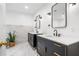 Bathroom featuring double vanity with black cabinets, white countertop, and marble style tile at 4411 Paces Battle Nw, Atlanta, GA 30327