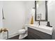 Modern powder room featuring a sleek vanity, black fixtures, and stylish decor at 4411 Paces Battle Nw, Atlanta, GA 30327