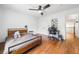 Spacious bedroom with hardwood floors, ceiling fan and adjacent study room at 4411 Paces Battle Nw, Atlanta, GA 30327