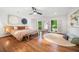 Bright and airy bedroom with hardwood floors and windows letting in ample natural light at 4411 Paces Battle Nw, Atlanta, GA 30327