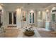 Elegant dining area with tiled floors, french doors, built-in shelves, perfect for hosting gatherings at 4411 Paces Battle Nw, Atlanta, GA 30327