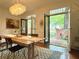 Light-filled dining room boasting an outside view with hardwood floors and contemporary accents at 4411 Paces Battle Nw, Atlanta, GA 30327