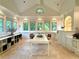Bright dining room features multiple windows and tiled floors creating a welcoming and spacious atmosphere at 4411 Paces Battle Nw, Atlanta, GA 30327