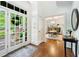 Bright foyer featuring hardwood floors, glass panel door, and an open view to the dining room at 4411 Paces Battle Nw, Atlanta, GA 30327
