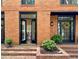 Close up of the front doors with black trim and mature landscaping at 4411 Paces Battle Nw, Atlanta, GA 30327