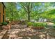 Well-maintained front yard with lush landscaping, a brick pathway, and a view of the classic brick home at 4411 Paces Battle Nw, Atlanta, GA 30327