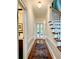 Hallway with hardwood floors leads to stairs and other rooms at 4411 Paces Battle Nw, Atlanta, GA 30327