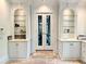 Elegant hallway featuring a bar area with glass shelves and a double door that enhances luxury at 4411 Paces Battle Nw, Atlanta, GA 30327