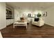 Inviting living room boasts hardwood floors, neutral furniture, and a built-in bookcase, perfect for relaxation at 4411 Paces Battle Nw, Atlanta, GA 30327