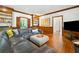 Open living room showcasing built-in shelving, hardwood floors and a comfortable sectional sofa at 4411 Paces Battle Nw, Atlanta, GA 30327