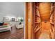 View into wine cellar from finished basement featuring custom wood racks for wine storage and climate control at 4411 Paces Battle Nw, Atlanta, GA 30327