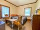 Bedroom offers ample natural light and wood accents, creating a cozy and inviting space at 505 Sandhill Hickory Level Rd, Carrollton, GA 30116