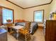 Comfortable bedroom featuring two windows and ample natural light at 505 Sandhill Hickory Level Rd, Carrollton, GA 30116