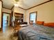 Bedroom with vinyl floors and natural light, providing a serene and comfortable space for rest and relaxation at 505 Sandhill Hickory Level Rd, Carrollton, GA 30116