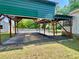 The expansive, covered parking area connecting the main house to the additional structure at 505 Sandhill Hickory Level Rd, Carrollton, GA 30116