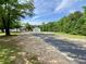 Exterior view of property featuring an outbuilding, the main home and a driveway at 505 Sandhill Hickory Level Rd, Carrollton, GA 30116