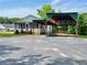 Exterior view of home with covered parking and nice front yard at 505 Sandhill Hickory Level Rd, Carrollton, GA 30116
