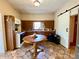 Spacious eat-in kitchen with ample counter space and classic cabinetry at 505 Sandhill Hickory Level Rd, Carrollton, GA 30116
