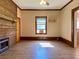 Living room has a wood fireplace and laminate floors at 505 Sandhill Hickory Level Rd, Carrollton, GA 30116