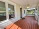 Inviting screened-in porch featuring wood flooring, ceiling fan, and natural light at 505 Sandhill Hickory Level Rd, Carrollton, GA 30116