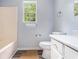 Bathroom with a tub, single vanity and toilet; the room is awaiting some modern touches at 1576 King Mill Rd, Mcdonough, GA 30252