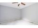 A bright bedroom with a ceiling fan and window that provides natural light ready for your personal touches at 1576 King Mill Rd, Mcdonough, GA 30252