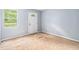 A bedroom features a window and a white door in need of flooring at 1576 King Mill Rd, Mcdonough, GA 30252