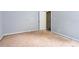 A bedroom with light blue walls features a window and closet in need of flooring at 1576 King Mill Rd, Mcdonough, GA 30252