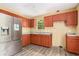 A spacious kitchen with stainless steel refrigerator and ample cabinetry, awaiting a personal touch at 1576 King Mill Rd, Mcdonough, GA 30252