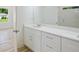 Bathroom vanity area features ample storage space, clean lines, and a well-lit mirror at 1888 Goddard Se St, Atlanta, GA 30315