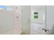Modern shower with glass door is bright and has an adjacent window-lit bedroom view at 1888 Goddard Se St, Atlanta, GA 30315
