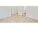 Bright bedroom featuring modern light wood flooring and neutral walls with white trim at 1888 Goddard Se St, Atlanta, GA 30315