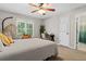 Serene bedroom with a stylish hanging chair, desk, and plenty of natural light at 235 Foxley Way, Roswell, GA 30075