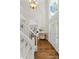 Bright foyer with hardwood floors, a staircase, and high ceilings at 235 Foxley Way, Roswell, GA 30075