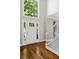 Bright foyer with beautiful hardwood floors, a soaring window above the door, and a staircase at 235 Foxley Way, Roswell, GA 30075