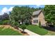 Attractive home with manicured lawn and driveway at 235 Foxley Way, Roswell, GA 30075