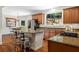 Spacious kitchen boasts granite countertops, stainless steel appliances, and center island with barstool seating at 235 Foxley Way, Roswell, GA 30075