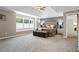 Spacious primary bedroom featuring a tray ceiling, sitting area, and many windows at 235 Foxley Way, Roswell, GA 30075