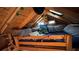 Cozy shed loft with a skylight, comfortable bed, and whimsical decorations at 235 Foxley Way, Roswell, GA 30075