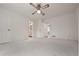 Bright bedroom featuring neutral carpeting, ample closet space, and direct access to an en-suite bathroom at 4137 Wellington Hills Ln, Snellville, GA 30039