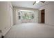 Bright bedroom with bay window and neutral carpeting, offering a serene and comfortable living space at 4137 Wellington Hills Ln, Snellville, GA 30039
