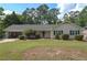 Charming single-story home with a well-manicured lawn and attached garage in a peaceful, wooded neighborhood at 4137 Wellington Hills Ln, Snellville, GA 30039