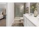 Well-appointed bathroom with a double vanity, a glass-enclosed shower, and contemporary finishes at 5615 Hislop Ln # 82, Mableton, GA 30126