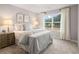 Bedroom with large windows provides natural light and peaceful scenery at 5615 Hislop Ln # 82, Mableton, GA 30126
