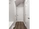 Hallway with wood floors provides access to multiple rooms and storage at 5615 Hislop Ln # 82, Mableton, GA 30126